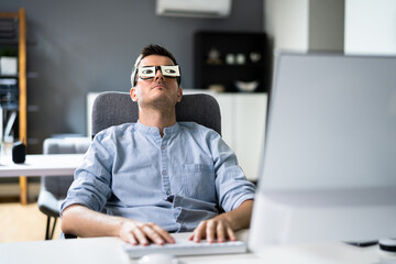 Tired Unhappy Businessperson Sleeping In Office