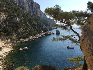 View of the Calanque des Pierres Tombées seen from the footpath descending to the Calanque de Sugiton in Marseille, France.