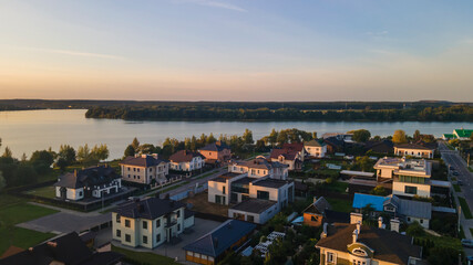 Aerialphoto suburbs of big city. Country houses, forests, lakeshore. Citylife concept.