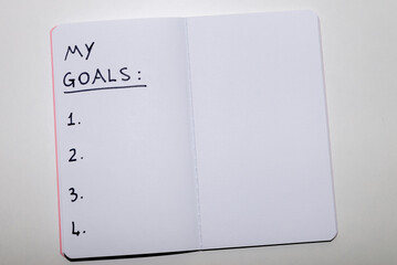 Notebook page marked 'My goals' in black ink on white paper. Goals and priorities of one's life. 

