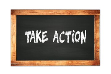 TAKE  ACTION text written on wooden frame school blackboard.