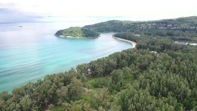 Aerial drone view of small island near tropical Layan Beach area in Phuket, Thailand