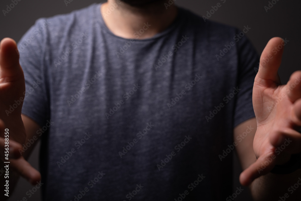 Poster man showing his empty hand.