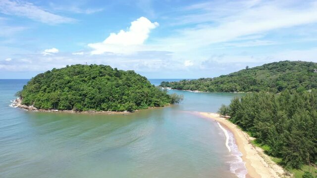 Aerial drone view of small island near tropical Layan Beach area in Phuket, Thailand
