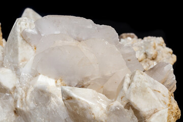 Macro mineral stone Snow quartz with calcite on a black background