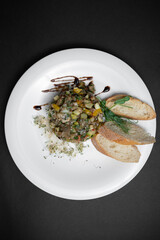 vegetable caviar or stew with eggplant, zucchini and bell pepper on white plate