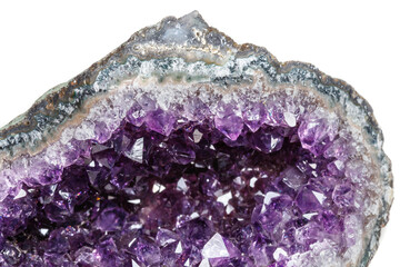 Macro Mineral Stone Amethysts in the rock on a white background