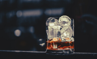 woman bartender making Cuba Libre cocktail in bar
