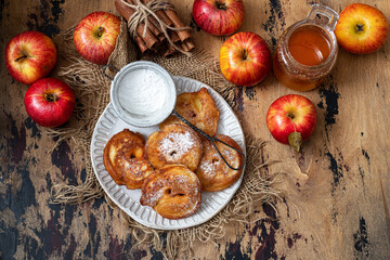 Sweet pancakes with apples, cinnamon and powdered sugar