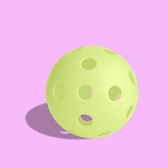 Single yellow pickball isolated on pink background.