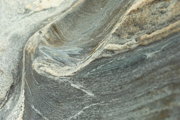 The texture of the stone. The surface of the rock is in detail. Beautiful background natural rock.