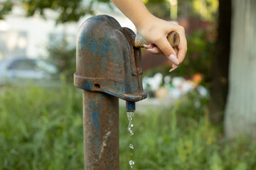 Pressurized water. Water supply hydrant in the village.