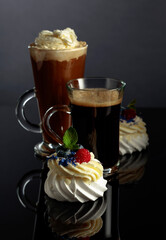 Small Pavlova desserts with raspberry, blueberry, and mint.