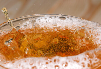 Drops and bubbles of light beer