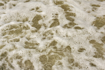 Abstract background from the waves and foam of the sea of the sea