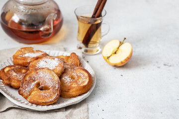 Apple pancakes with cinnamon and powdered sugar