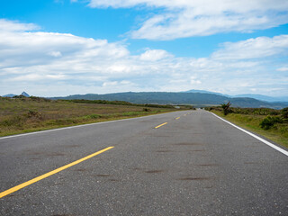 Road in Kenting with on the horizon mountains and coast.