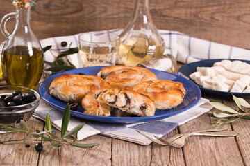 Pastry swirls with cheese and olive filling.
