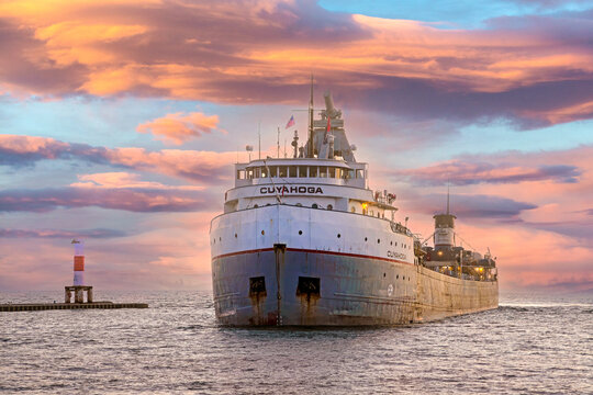 Cuyahoga freighter entering Holland Harbor in Holland Michigan at sunset time