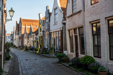 Walking in old Dutch town Zierikzee with old small houses and streets