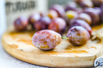 Indoor studio fresh prunes close-up