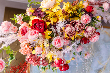 decoration of the banquet hall with artificial flowers