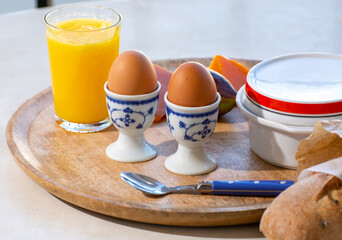 Continental breakfast with soft-boiled chicken egg served outdoor