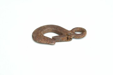 A vintage hook peeling was rustting on body cause oxidation lay down white backgrounds. 