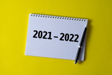 2021 - 2022 written in a notebook - business concept.