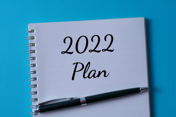 Word writing text 2022 plan in a notebook. Business concept.