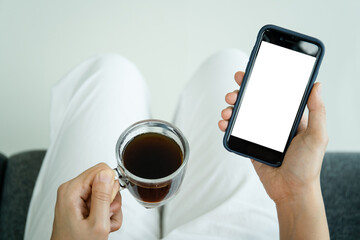 Mockup smartphone with isolated blank screen. Young Asian woman texting and exploring social media.