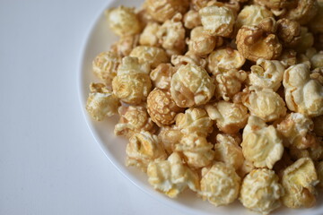 Popcorn covered with icing and caramel with sugar