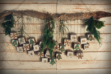 Homemade advent calendar made of cardboard for a environmentally conscious christmas. Hanging...