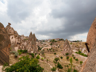 Fototapeta na wymiar The valleys of Cappadocia with caves in the rocks