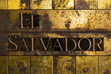 El Salvador text message on textured grunge gold and vintage copper background
