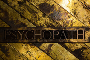 Psychopath text on vintage textured copper and gold background - obrazy, fototapety, plakaty