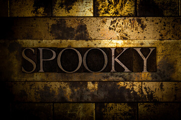Spooky text message on textured grunge copper and vintage gold background