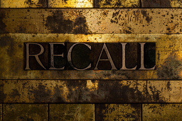 Recall text message on textured grunge copper and vintage gold background