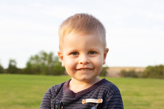 portrait of cute little 3 year old boy outdoor