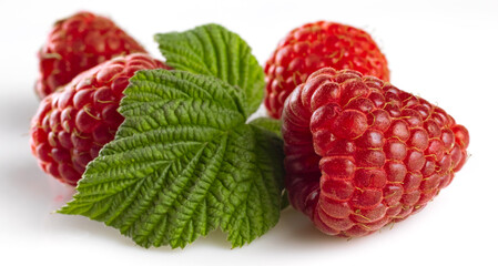 image of raspberries with leaves on a white background