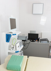 The interior of a medical office with equipment for conducting video endoscopy study with a doctors workplace equipped with office equipment