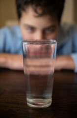 A child with a glass of water