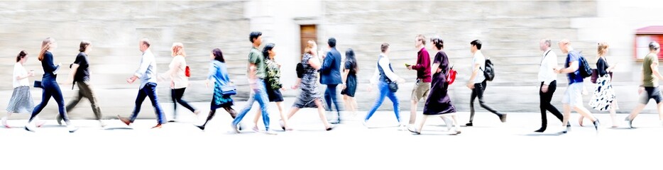 Walking people blur wide background. Lots of people walking in the City. Business concept...