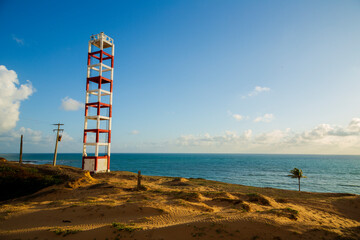 farol de são roque com coqueiro e mar. barra de maxaranguape, rio grande do norte, brasil © Cenas brasileiras