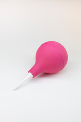 purple enema ot syringe bulb. Isolated on white