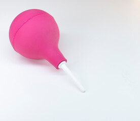purple enema ot syringe bulb. Isolated on white