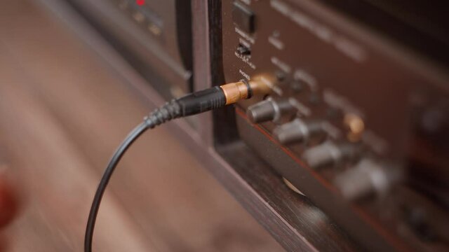 Insert headphones into the tape recorder