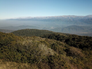 Villa Nougues area in the hills of Tucumán, town, meadow, wooded hills in autumn