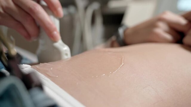 Ultrasound of the abdomen. Ultrasound of the abdominal cavity of a teenage girl.