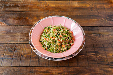 Moroccan recipe for tabule de couscous with chopped vegetables and olive oil